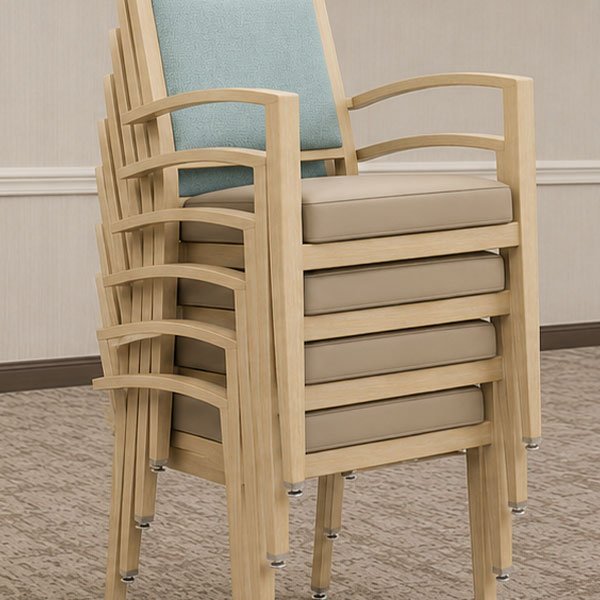 Hospitality seating stacked five chairs high for efficient storage