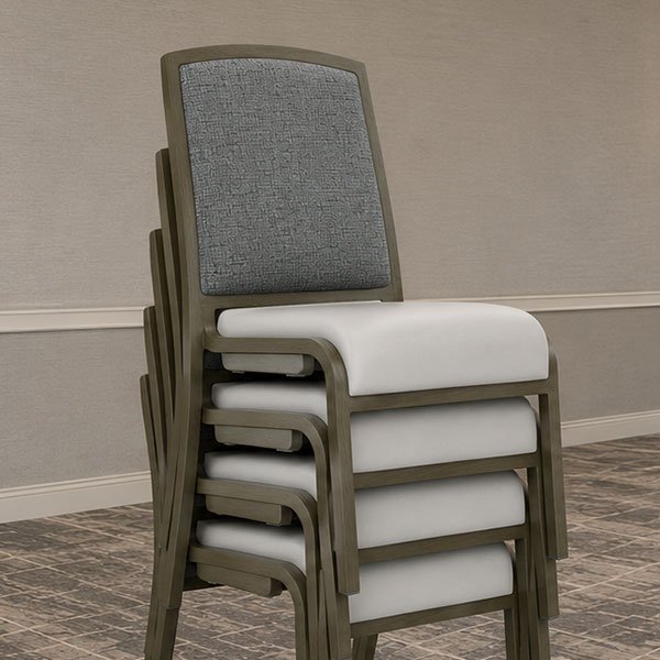 Hospitality seating stacked five chairs high for efficient storage