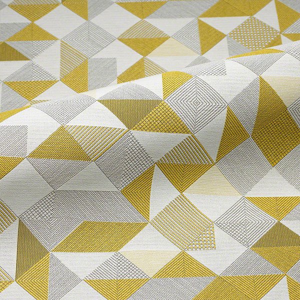 Commercial upholstery fabric with geometric pattern in yellow, grey, and neutral tones
