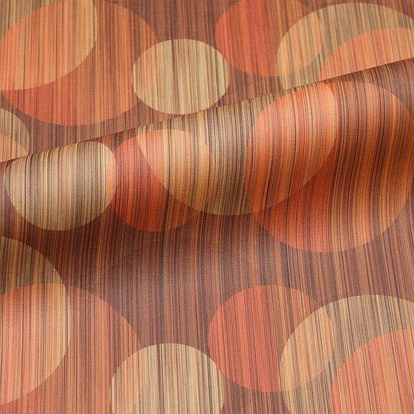 Commercial upholstery fabric with geometric pattern in red, yellow, and neutral tones