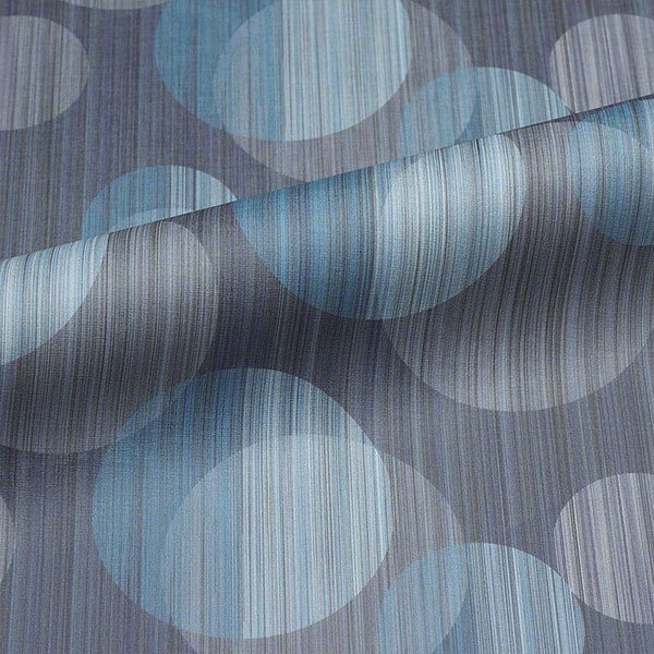 Commercial upholstery fabric with geometric pattern in blue, light blue, and neutral tones