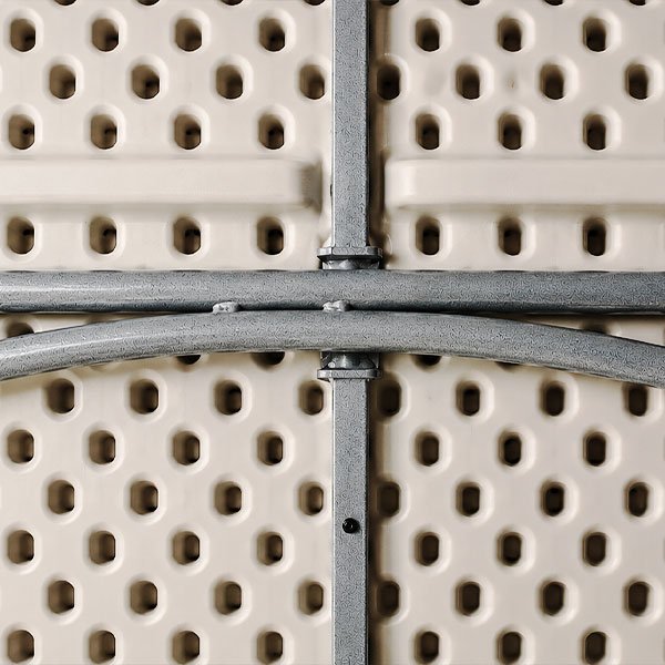 Close-up of the honeycomb-molded underside and reinforced steel frame of a commercial folding table.
