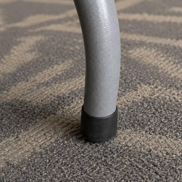 Close up of folding table with plastic cap on leg.