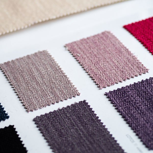 Commercial upholstery fabric swatches showcasing seating customization options for hospitality environments.